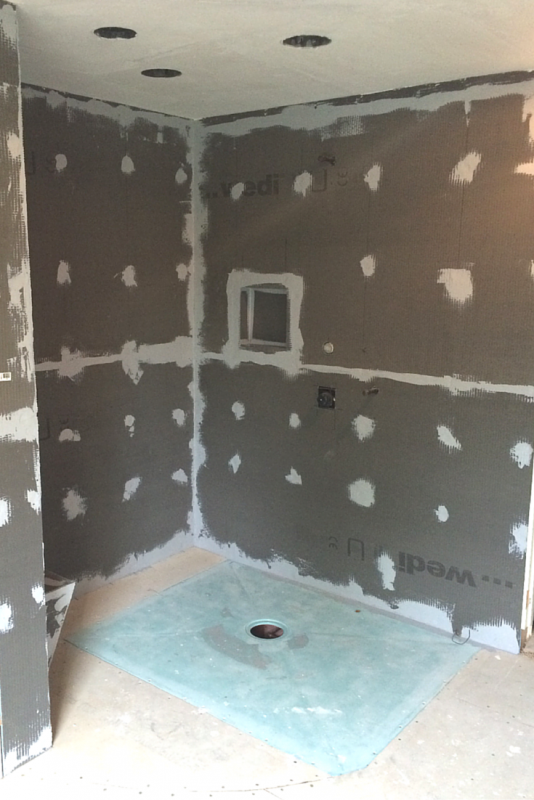 Barrier free wet room shower and waterproof wall board during the installation process 