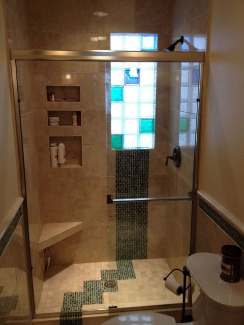 Glass tile and marble shower with colored and frosted glass blocks