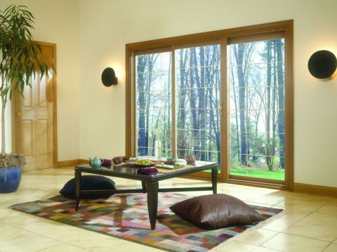 3 Panel Sliding Patio Door with Wood Veneer in a Family Room