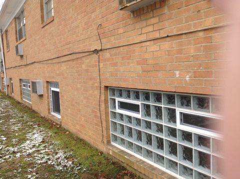 Apartment building lower level glass block windows