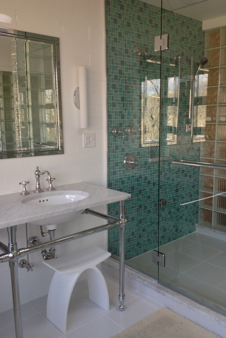 Master bathroom remodel with glass block shower and bright glass tile shower wall