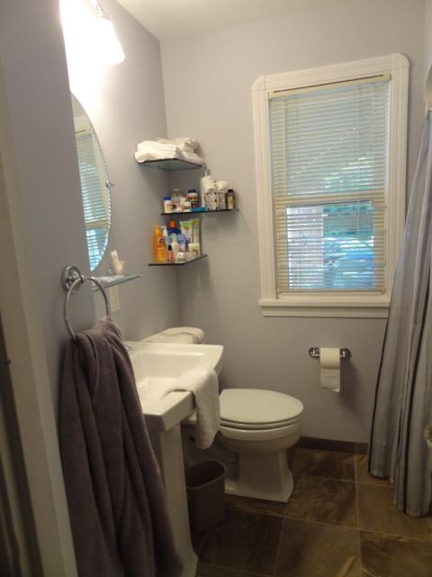 Finished small bathroom remodeling pic pedestal sink and floating glass shelves