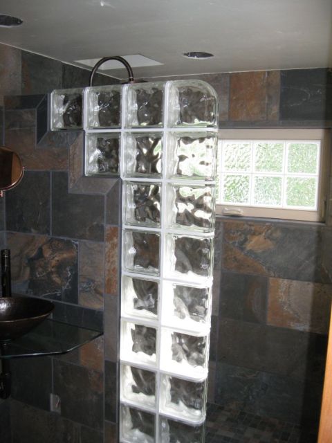 Step down glass block wall, glass counter with copper vessel sink