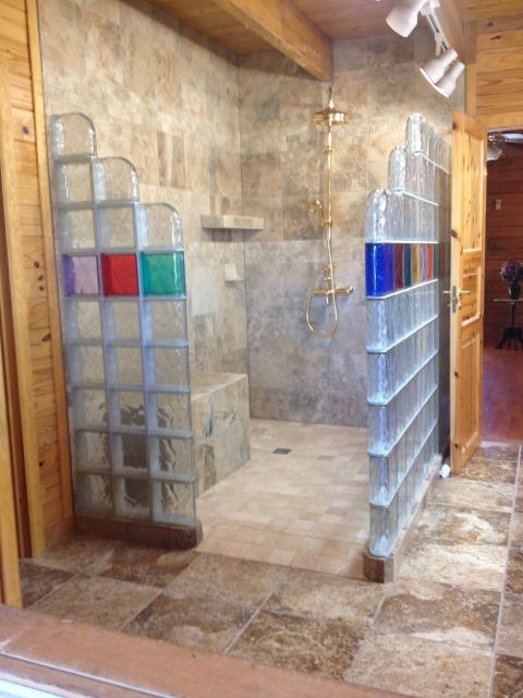 Glass block shower with colors in a log home