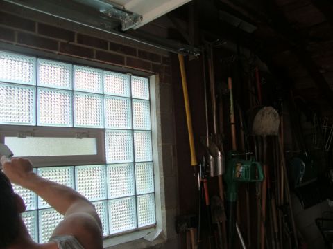 Garage windows using glass blocks being mortared for high security and increased privacy