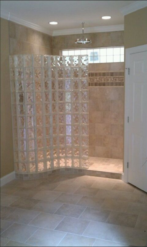 Pool house room addition with serpentine glass block shower wall