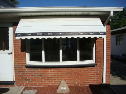 Non operable bow window before installation with an awning