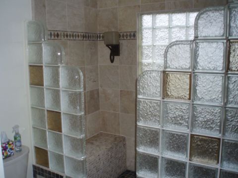 Step down glass block shower with colored glass blocks