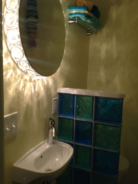 A closet turned into a cool retro half bathroom in Cleveland Heights