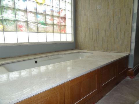 Tub transfer & decorative glass block window in universal design home