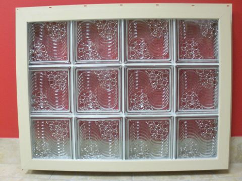 Vinyl framed glass window with a tan frame