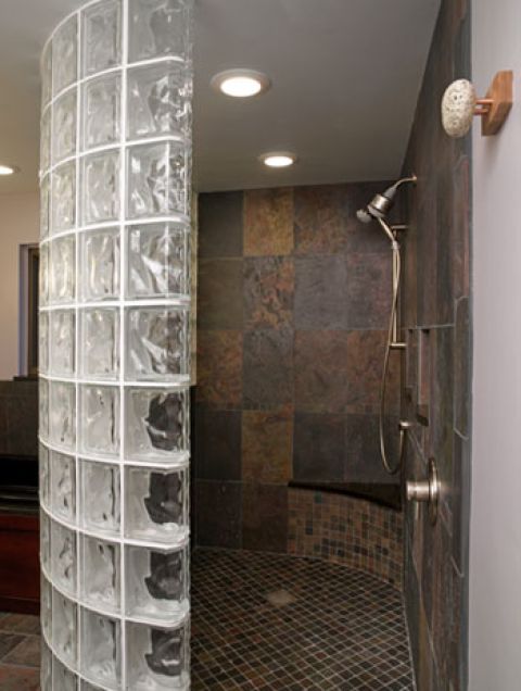 Curved glass block shower wall.