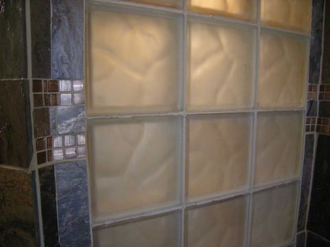 Frosted and colored glass block shower window close up