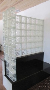 Glass block shower wall on granite bench seat 