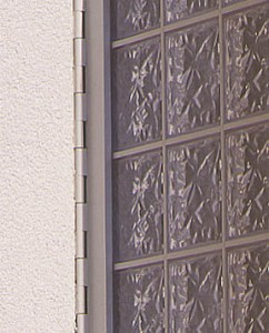 Acrylic block casement window hinge close up 