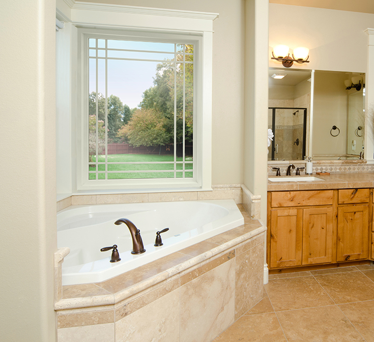 Advantage 3 prairie style picture window above a soaking tub in a Cleveland master bathroom | Innovate Building Solutions #Soakingtub #Picturewindow #ClevelandWindow