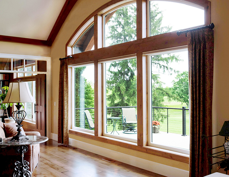 Advantage picture window with shaped windows at the top Cleveland | Innovate Building Solutions #Picturewindow #LivingRoom #GreatRoom