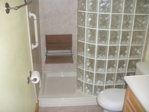 Glass block walk in shower fold down seat and grab bar 