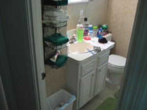 Before small bath remodeling cramped bathroom with a cabinet