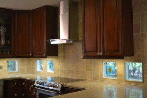 Glass tile blocks used as a kitchen backsplash to add style and natural light from the outside