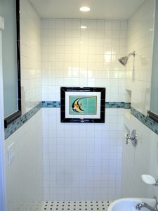 Close up of white tile shower before glass block partition walls were added