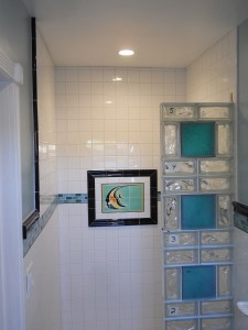 Glass block shower wall installation system with catalina tile background