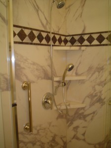 Hand held shower, 3 corner shelves, Sentrel interior wall panes and grab bar in Cleveland Ohio project 