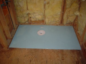 Roll in shower base during installation set on joists