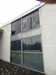 Aluminum storefront openings with single pane glass before the glass block installation 