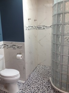 Glass tile accent and tile in toilet area