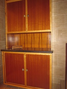 Ribbon wood and beech trim  cabinet with rock door knobs