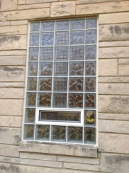 Close up of cross design in a glass block window using wave and pristal glass blocks