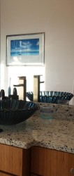 Vertrazzo recycled glass countertop and blue shell vessel sink 