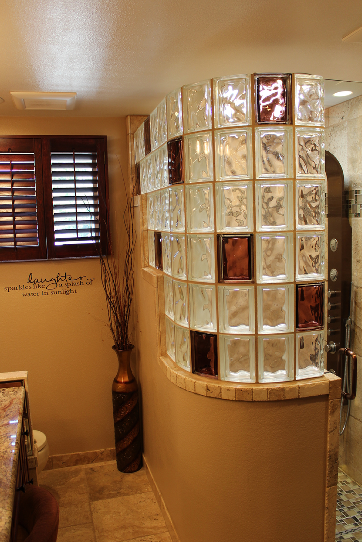 Curved colored glass block shower wall