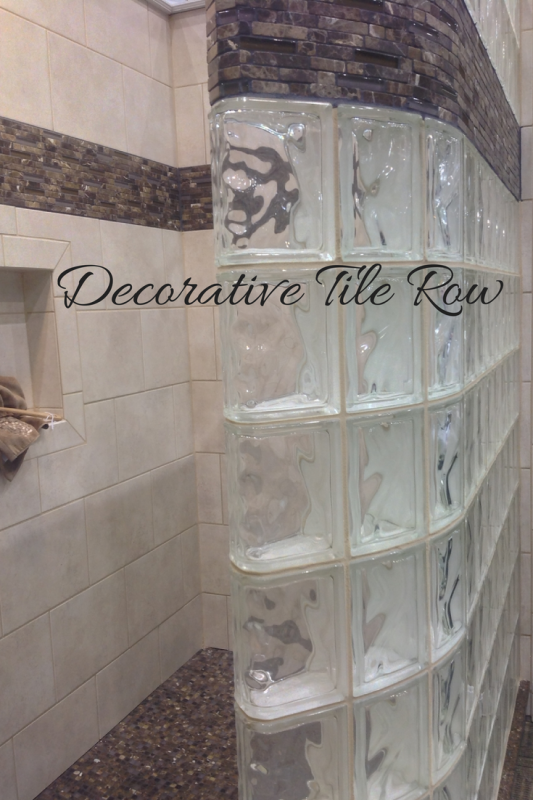 Decorative tile row in a glass block curved wall