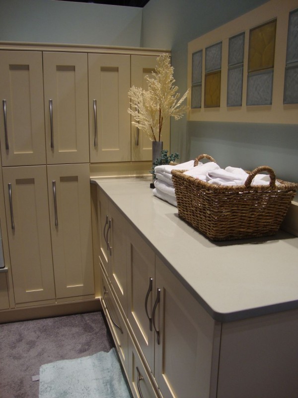 Colored and frosted glass block backsplash in a laundry room 