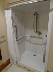 One piece roll in shower system 