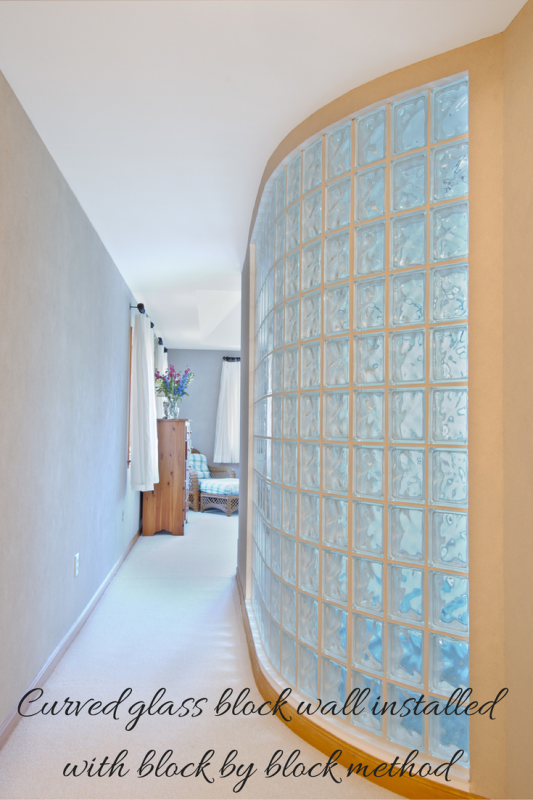 Curved glass block bedroom wall using block by block installation process