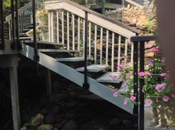 Wood stairs and railing in a Columbus landscape design 