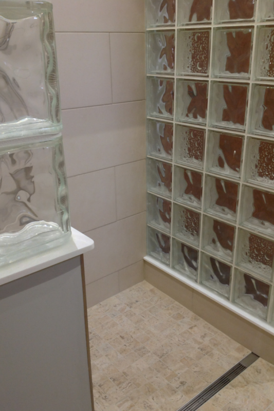 Glass block wall in an accessible bathroom Seascapes Decora Patterns