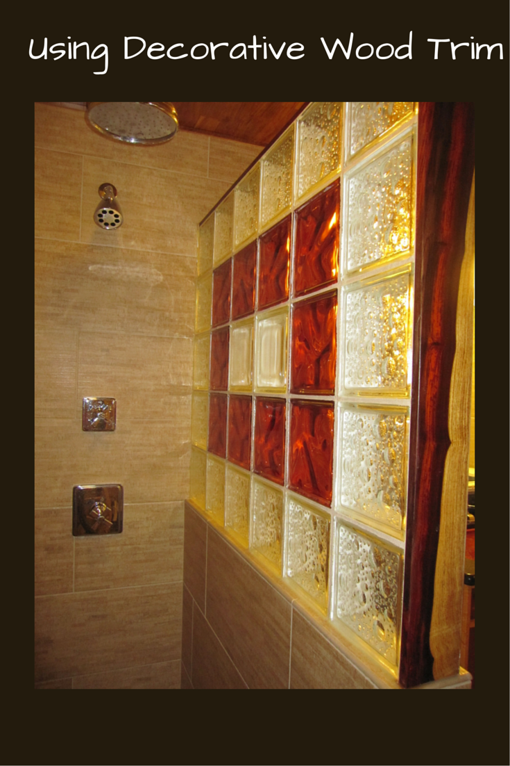 Decorative cocobolo wood trim to finish off the end of a straight glass block shower wall | Innovate Building Solutions