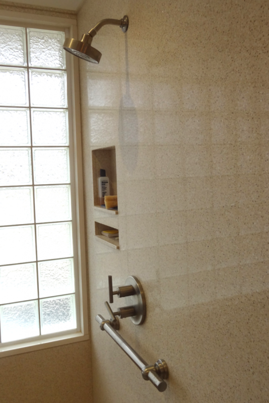 Solid surface wall panels with recessed niches for a better universal design