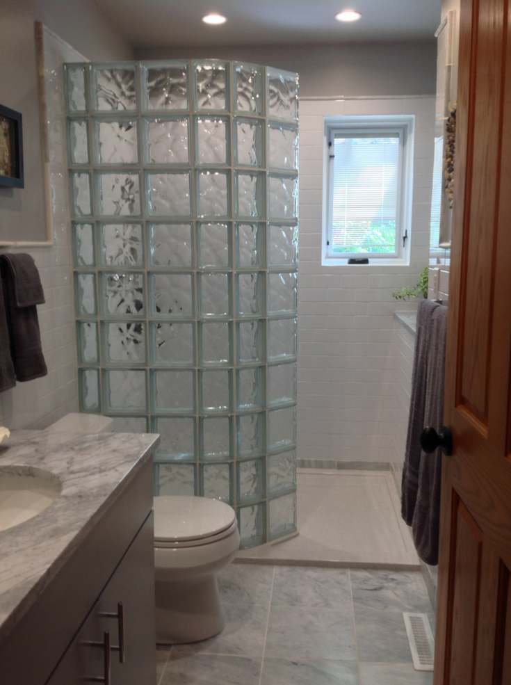 Curved glass block walk in shower wall and base in a Columbus Ohio home | Innovate Building Solutions