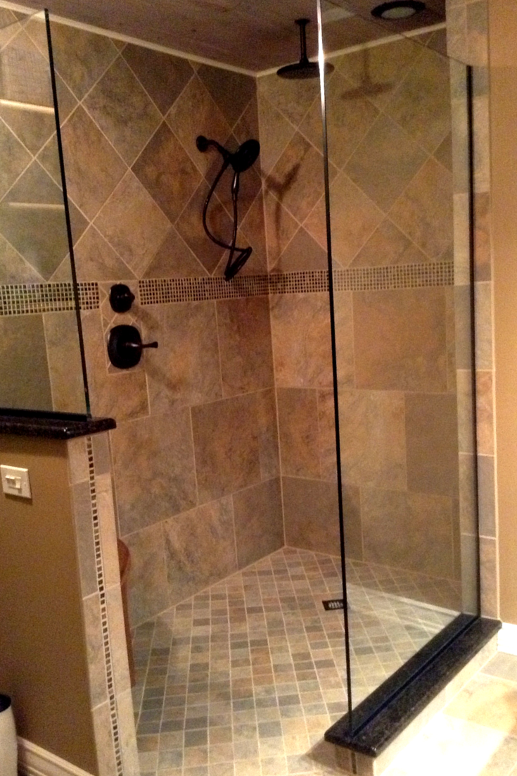 Frameless glass shower wall panels make this shower feel bigger by not dividing spaces| Innovate Building Solutions