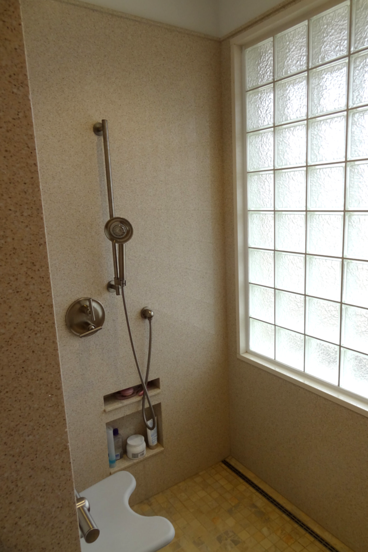 A recessed niche placed lower to be reached by someone in a wheelchair accessible shower | Innovate Building Solutions