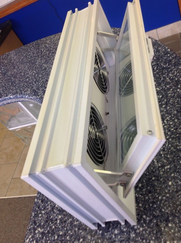 Power air vent for circulation through a glass block basement window