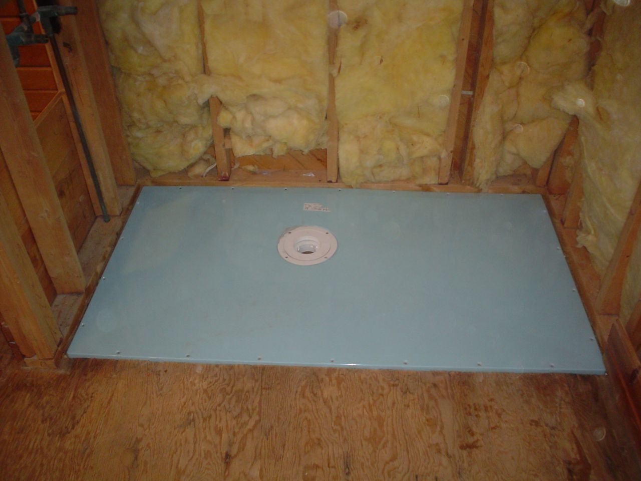 shower base former for a wet room system in a one level walk in shower 