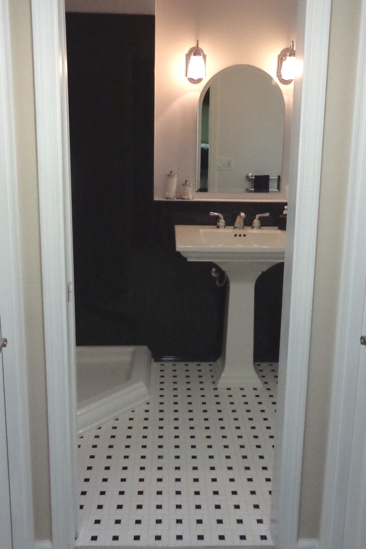 American Olean 12 x 12 x 1/8 black and white mosaic tile in a bathroom remodel