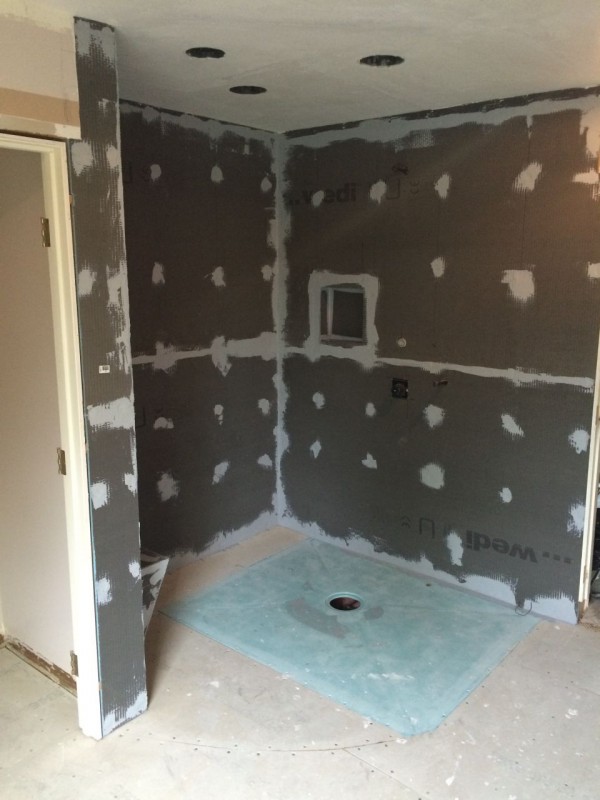 Wall backer with waterproof shower base former
