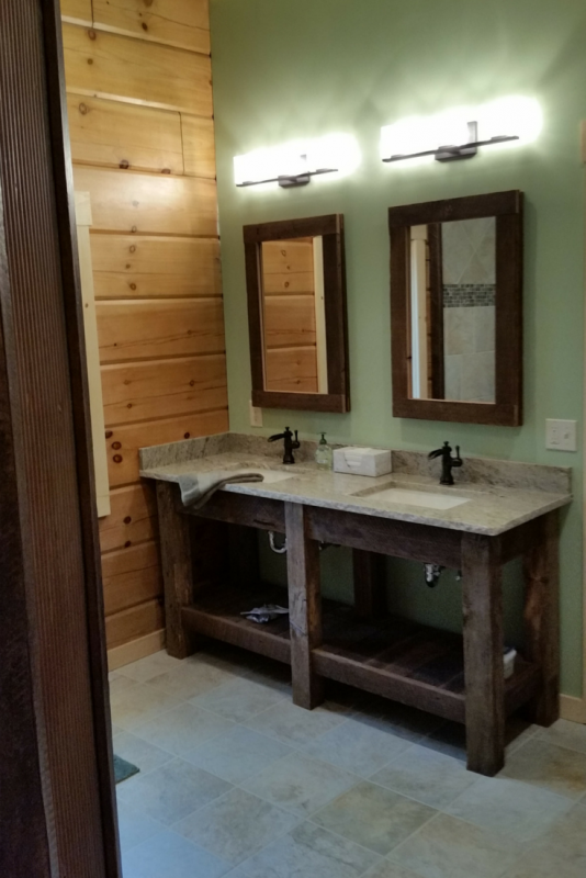 Typhoon green granite countertops with a chiseled edge in a log home